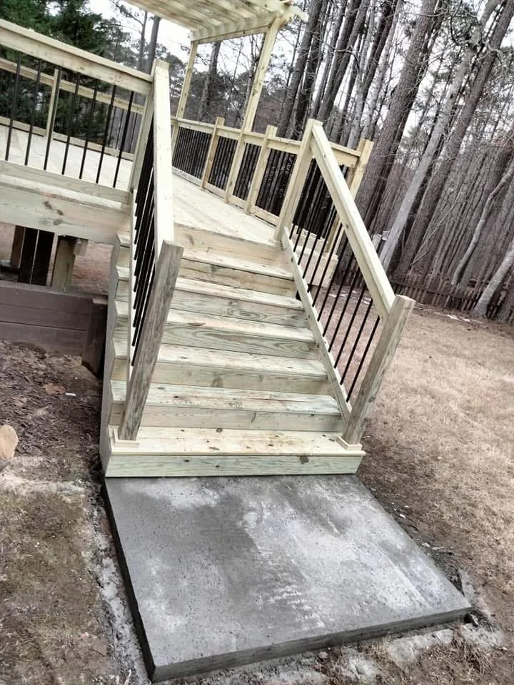 Westchase deck construction - deck staircase with concrete pad