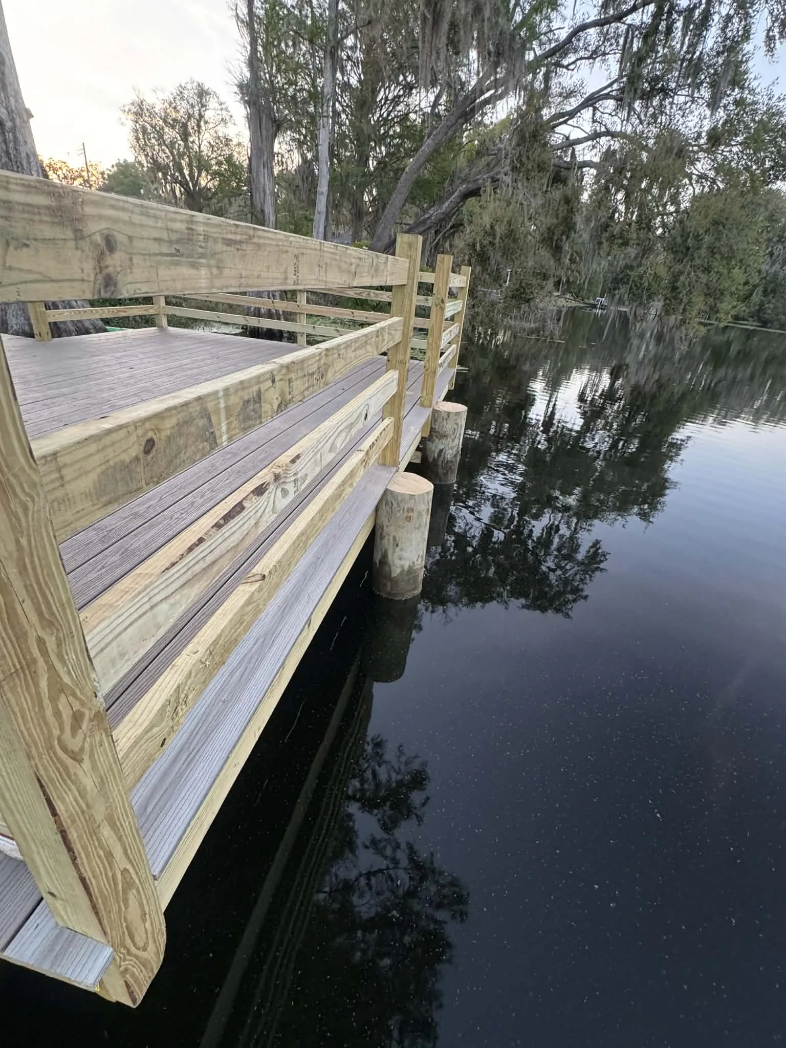 Lutz deck construction - dock deck boards with water view