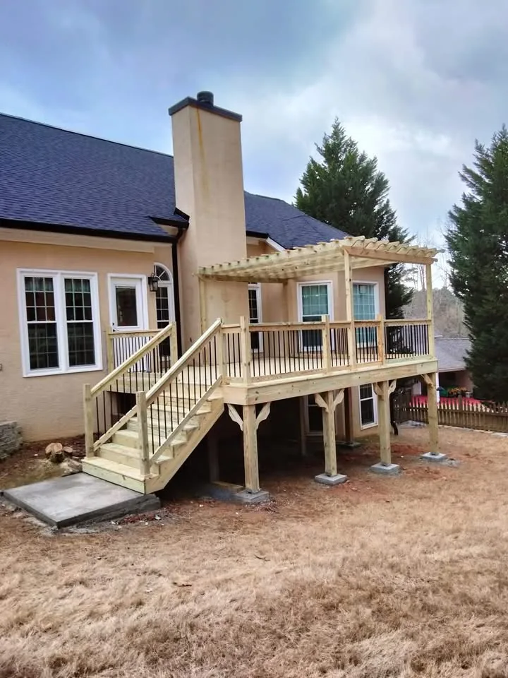 Land O Lakes deck construction - pergola deck with stair railing